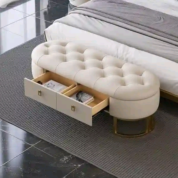 Rounded cream tufted storage ottoman with two open drawers