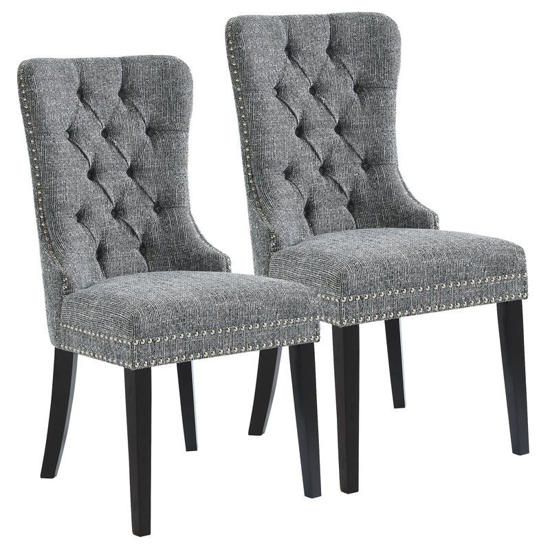 Pair of grey high-back button-tufted dining chairs with dark tapered legs