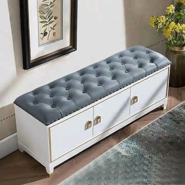 Blue-grey button-tufted storage bench with white drawers